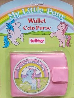 a pink wallet with two unicorns on it