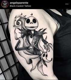 a person with a skeleton tattoo on their arm