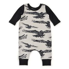 a baby romper with black sleeves and an eagle print on the front, is shown