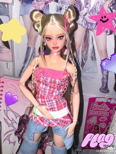 a barbie doll is standing in front of a poster