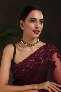 The Polki choker necklace is inspired by the rich Indian jewelry-making techniques handcrafted by the artisans to celebrate perfect armor between ancient and modern concepts. The gold plated western necklace can be paired with your Indo western dresses gracefully. Pair this gorgeous replica of Bollywood jewelry with your ethnic or contemporary ensembles and create a look to remember. Necklace Closure - Adjustable Dhori. Style Tip - The tasteful design will keep you hooked every time you look at Heavy Formal Choker Necklace, Festive Bridal Choker Necklace For Formal Occasions, Formal Festival Choker Necklace, Elegant Festive Choker, Festive Formal Bridal Choker Necklace, Elegant Kundan Necklace With Cutdana For Party, Elegant Party Kundan Necklace With Cutdana, Heavy Choker Necklace For Party, Elegant Cutdana Choker For Festivals