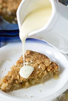 a piece of pie is being poured with milk