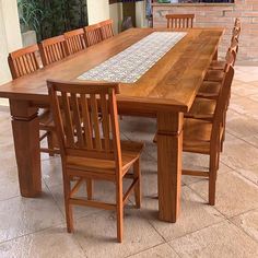 a large wooden table with chairs around it