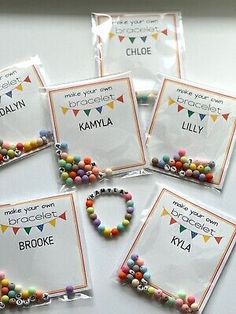 six bags of personalized bracelets with name tags