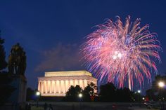 fireworks are lit up in the night sky over lincoln memorial