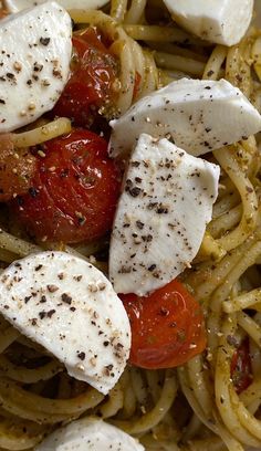 pasta with tomatoes, mozzarella and mushrooms on it