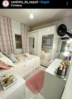 a bedroom with pink and white decor in it