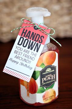 a jar of peaches with a label on it sitting on top of a table