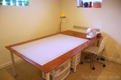 the sewing table is made from an old piece of wood