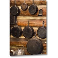 pots and pans are hanging on the wall