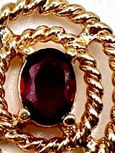 Vintage 90's gold plated pendent  with oval prong set cultured ruby  placed in the centre  of a barly twist  gold plated double ring frame  with a chain feed loop  pre owned in a great condition  listing is for pendent only no chain sorry  make a lovley gift  size  2.5 x 1.5 cm ruby 8mm x 4 mm weight 3 grams Vintage Oval Gold Plated Jewelry, Vintage Gold Plated Oval Jewelry, Oval Ruby Gold Necklace, Gold Oval Ruby Necklace, Vintage Ruby Pendant Jewelry, Classic Red Oval Pendant Jewelry, Ruby Oval Pendant In Yellow Gold, Yellow Gold Ruby Oval Pendant Jewelry, Antique Ruby Pendant