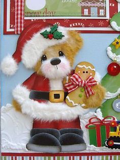 a christmas card with a teddy bear holding a gingerbread