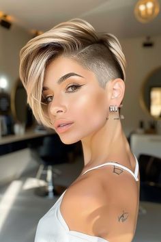 Step out of your comfort zone and into the spotlight with our bold selection of 41 short hairstyles for women. These cutting-edge looks are perfect for fashion-forward females looking to make a statement and simplify their routine. Whether you're after a subtle change or a complete overhaul, find your next hair hero here. Tap the link for more style inspiration! Short Hairstyle Women With Shaved Side, Short Bob Undercut Hairstyles, Female Shaved Hairstyles, Short Hairstyle Women Shaved Sides, Pixie Undercut Hairstyles, Female Undercut, Long Pixie Cut With Bangs, Female Short Hairstyles, Short Undercut Hairstyles