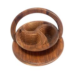 three wooden bowls sitting on top of each other