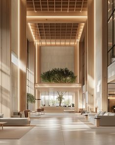 an empty lobby with couches, tables and plants on the wall in it's center