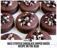 chocolate covered cookies with white and brown decorations