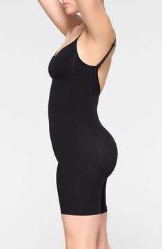 Sculpt your natural shape with a mid-thigh bodysuit that holds in your core, lifts your butt and supports your chest flawlessly even in backless outfits. V-neck Adjustable straps 82% nylon, 18% spandex Machine wash, line dry Made in Turkey Black Sleek Shapewear With Built-in Bra, High Stretch Shapewear Bodysuit With Built-in Bra, Black Shapewear With Built-in Bra And High-cut Leg, Seamless Shapewear Bodysuit, Smoothing Shapewear Bodysuit, Shaping Backless Bodysuit Shapewear, Seamless High-cut Leg Shapewear Bodysuit, Seamless Shapewear Bodysuit With High-cut Leg, High Stretch Smoothing Sleeveless Shapewear