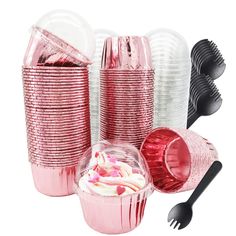 pink party supplies including cups, forks and spoons