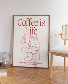 a coffee is life poster sitting on the floor next to a chair