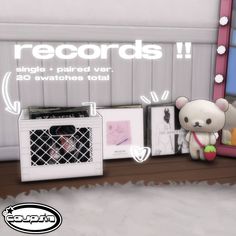 a teddy bear sitting next to a window with records on the shelf and an air conditioner in front of it