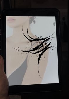 a person holding an electronic device with a drawing on the screen in their hand,