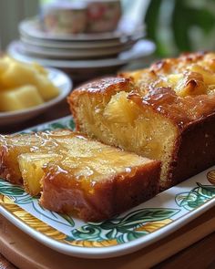 slices of pineapple upside down pound cake on a plate next to other plates and bowls