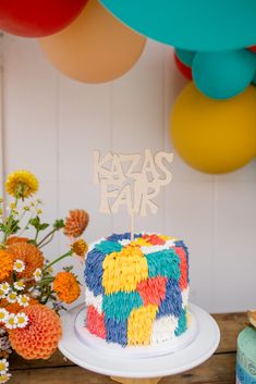 a colorful cake sitting on top of a table