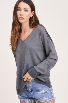 There is no such thing as too many basic tops in one closet! Its absolutely perfect for all the layering or even cute enough to sport on its own. You just can't go wrong with a simple waffle top, and with the v neckline and contrasted edges//stitching, you’ll be grabbing for this one all. Season. Long! Pair the Kacey Top with some distressed denim, a flannel or shacket, some booties and top it off with an wide brimmed hat to tie your outfit together! The deets! : true to size relaxed fit v neck Gray Ribbed V-neck Top, V-neck Loungewear Top With Ribbed Cuffs, V-neck Top With Ribbed Cuffs For Loungewear, Sporty Ribbed Tops For Layering, Ribbed V-neck Top For Layering, Trendy Waffle Knit Top For Loungewear, Textured Knit V-neck Top For Layering, Gray Textured Knit V-neck Top, Casual Gray Waffle Knit Top