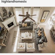 an overhead view of a living room with couches, coffee table and ceiling fan