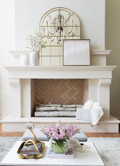 a living room filled with furniture and a fire place in front of a wall mounted mirror