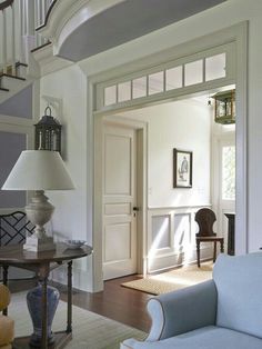 a living room filled with furniture and a spiral staircase