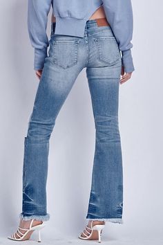 Details Style No. AT1029BTM Elevate your denim collection with Low Rise Stretch Distressed Bootcut Jeans – a fusion of comfort, style, and edgy design that adds a unique touch to your ensemble. Highlights Super Stretchy Denim Comfort High-Quality Material Distressed Detail Low Rise Chic Natural Frayed Hem Medium Stone Wash Shape & fit Bootcut Low rise Frayed Hem Specifications: Front Rise: 8 inches Inseam: 32 ½ inches Leg Opening: 19 inches Model Details: MODEL IS 5' 9" WEARING SIZE 26 Fitted Ripped Washed Blue Flare Jeans, Fitted Washed Blue Ripped Flare Jeans, Distressed Fitted Urban Flare Jeans, Urban Distressed Fitted Flare Jeans, Urban Style Distressed Fitted Flare Jeans, Edgy Denim Blue Flare Jeans For Fall, Urban Distressed Flare Jeans For Fall, Chic Natural, Edgy Design