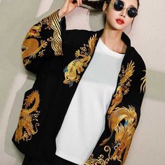 Feel like Like a Japanese Royalty With a rich and elegant design, this Gold Embroidered Japanese Coat will make you feel like royalty. This coat features embroidery that is done in a fine quality thread to create an intricate dragon print which makes it stand out on the kimono jacket! No matter the occasion formal or informal, you'll definitely get noticed! Details Women's Jacket Full Sleeves Embroidered Gold Dragon print Unisex Composition Polyester & spandex Maintenance Tips Hand wash or dry c Japanese Coat, Painted Dragon, Fall Cardigans, Gold Dragon, Black Dragon, Gold Print, Cotton Cardigan, Embroidered Jacket, Kimono Jacket