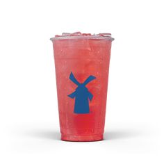 a red plastic cup with a blue windmill on the side and ice in front of it