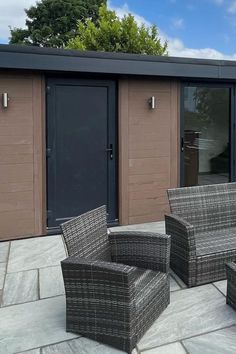 Image featuring a modern walnut dark brown composite cladding garden room with a paved patio, surrounded by greenery Outdoor Luxury, Paved Patio, In Peace, Entertaining Guests