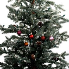 a christmas tree with ornaments hanging from it's branches