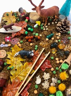 there are many different items on the table together, including leaves and other things to make it look like they have been made out of wood