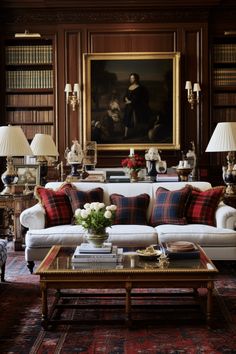 a living room filled with furniture and bookshelves next to a painting on the wall