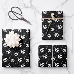 wrapping presents with black and white skulls on them