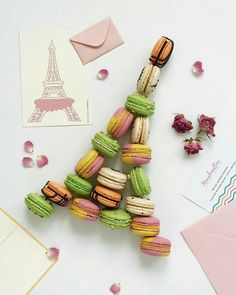 macaroons are arranged in the shape of the eiffel tower