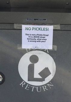 there is a sticker on the back of a parking meter that says no pickles