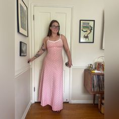 This is a gorgeous 1970s vintage maxi dress.  Made of a double knit poly, it is a maxi length spaghetti strap style dress in a pastel pink. It has triangle shaped white diagonal stripes and the neckline and straps are white. The dress zips up the back with a white zipper. In good vintage condition, no major flaws to note. Has no size tags, measurements in line with a small - use measurements in photos for best fit. Pink Lined Maxi Dress With Spaghetti Straps, Pink Spaghetti Strap Lined Maxi Dress, Rose Pastel, Vintage Maxi Dress, Diagonal Stripes, 70s Vintage, Double Knit, White Striped Dress, White Maxi Dresses