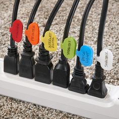 the wires are connected to each other with different colored tags on them and labeled in black, white, yellow, red, blue, green, and orange