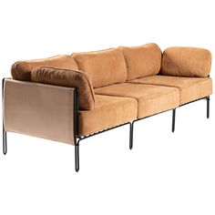 a brown couch sitting on top of a metal frame