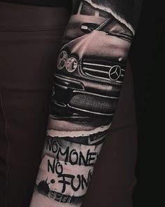 a man's arm with a car and the words no one is fun on it