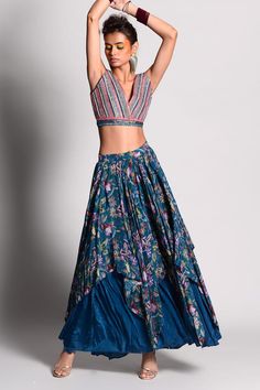 Teal asymmetric layered flared skirt with multi-color tropical print. Comes with thread embroidered crop top.
Component: 2
Printed, Embroidered
Neckline: V Neck
Sleeve Length: Sleeveless
Fabric: Crepe, Dupion
Color: Blue, Green
Layered skirt
 - Aza Fashions Summer Bohemian Long Skirt Lehenga, Summer Bohemian Long Lehenga, Bohemian Floral Print Lehenga For Summer, Bohemian Summer Lehenga With Floral Print, Bohemian Summer Lehenga With Floral Embroidery, Summer Bohemian Floral Print Choli, Fitted Summer Choli With Long Skirt, Fitted Choli With Long Skirt For Summer, Bohemian Summer Floral Choli