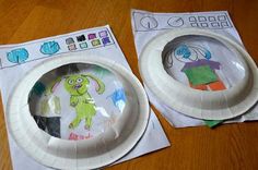 two paper plates that have been made to look like cartoon characters