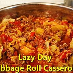 a close up of a pan of food with the words lazy day cabbage roll casserole