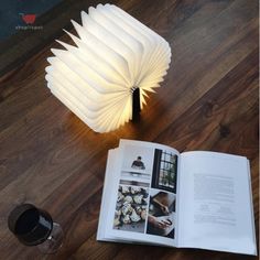 an open book sitting on top of a wooden table