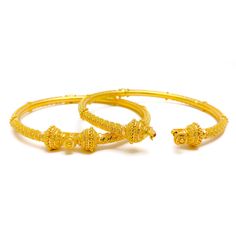 These 22k gold pipe bangles, weighing a total of 33.1 grams, are perfect for festive occasions with their traditional design. The yellow gold finish enhances their timeless and elegant appeal, making them ideal for celebrations. Each bangle has a size of 2.6 with an opening diameter of 2.35 inches, ensuring a comfortable fit. Sold as a set of two, these bangles are ideal for those who appreciate classic and stylish jewelry. Their exquisite craftsmanship and radiant gold make them standout pieces in any collection, adding a touch of festive grandeur to your ensemble. PRODUCT DETAILS Gold Purity(karat): 22k Gold Weight(grams): 33.1 Item Finish: Yellow Gold Bangle Size: 2.6 Bangle Opening(diameter): 2.35" Number Of Pieces: 2 Bangles